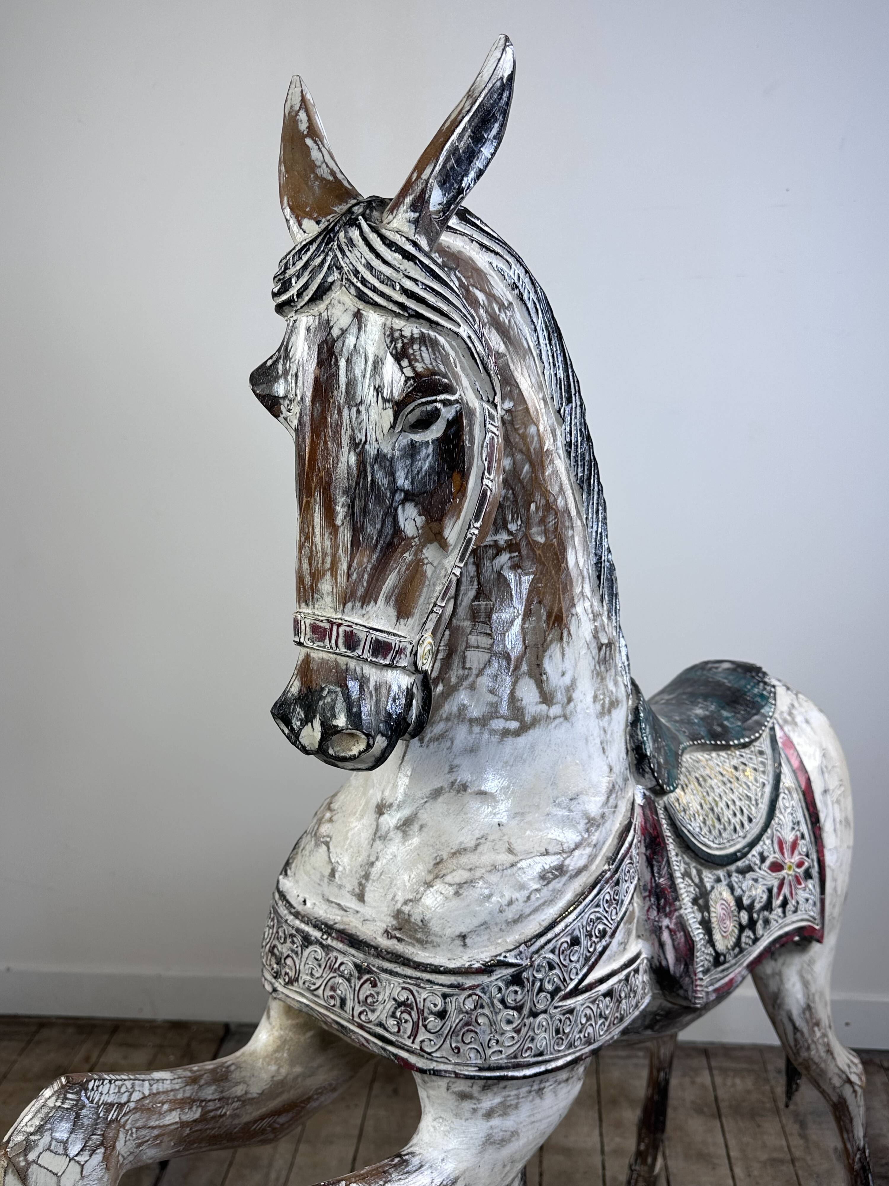 Carved and patinated wooden carousel horse