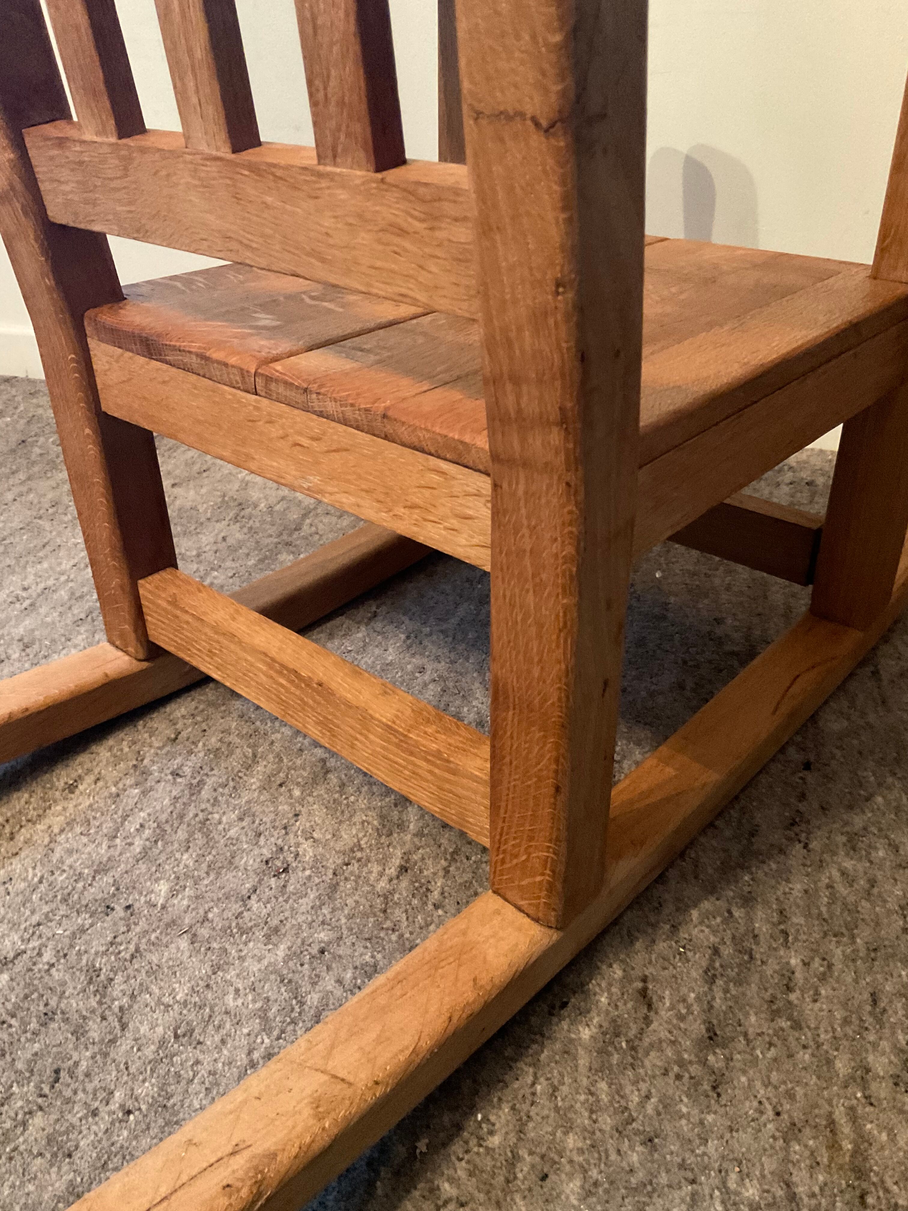Old children's rocking chair in solid wood