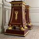 Pair of plaster bases imitating porphyry and gilded bronze circa 1980.
