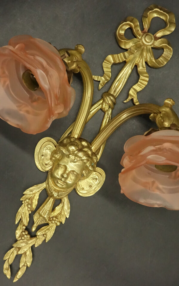 Pair of sconces with the heads of Zephyr Louis XVI style