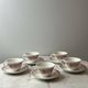 Set of 5 cups and saucers Sarreguemines with red rose decoration.