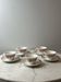 Set of 5 cups and saucers Sarreguemines with red rose decoration.