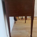 English wooden desk on top of leather