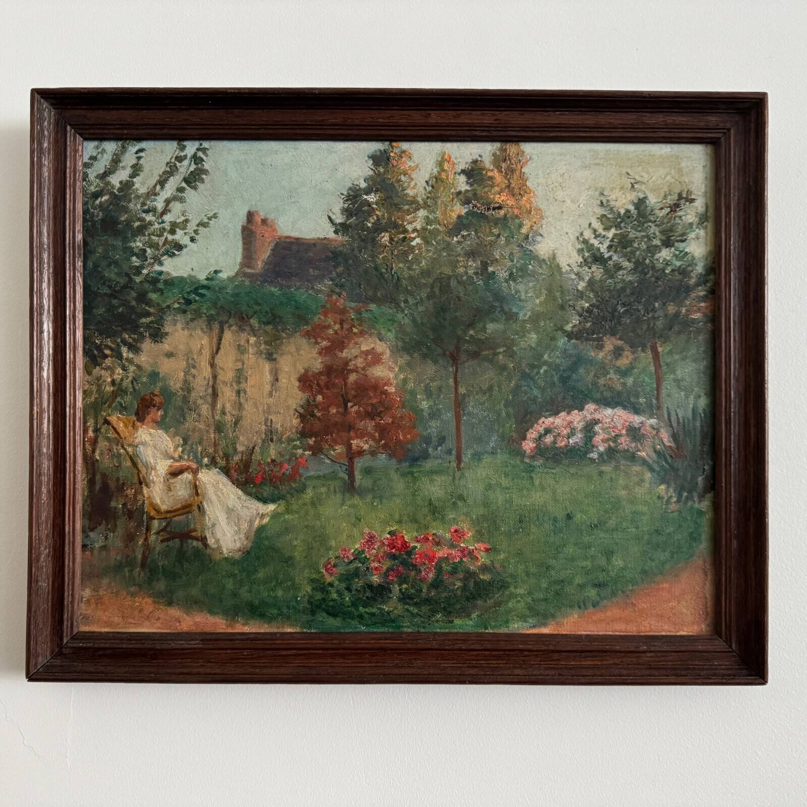 Oil on canvas park scene with a woman sitting in an armchair