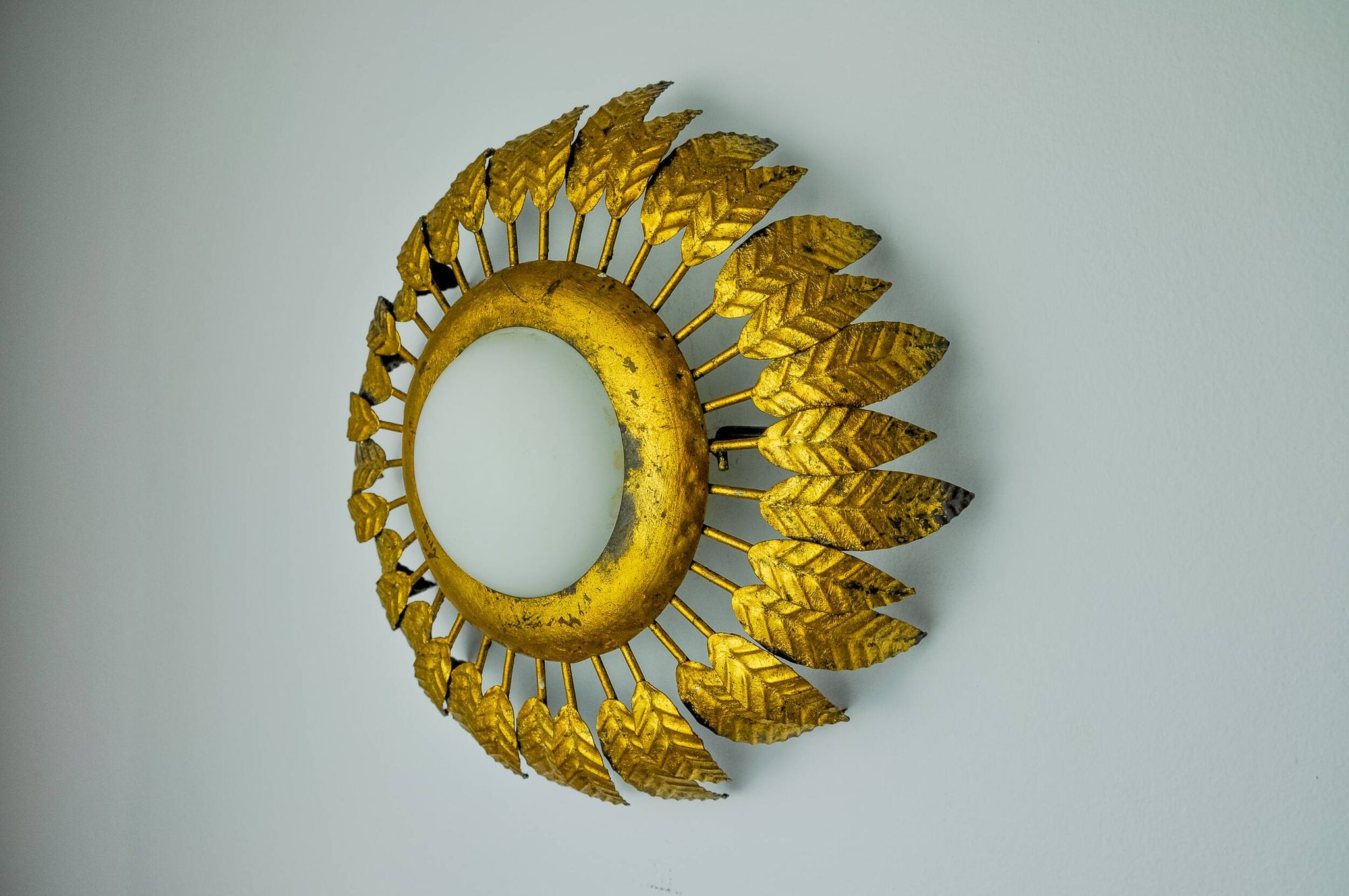 Sun wall lamp by ferro arte, metal and gold leaf and opaline glass, Spain, 1960