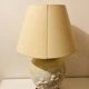 1980s ceramic table lamp with a wooden base and adjustable shade.