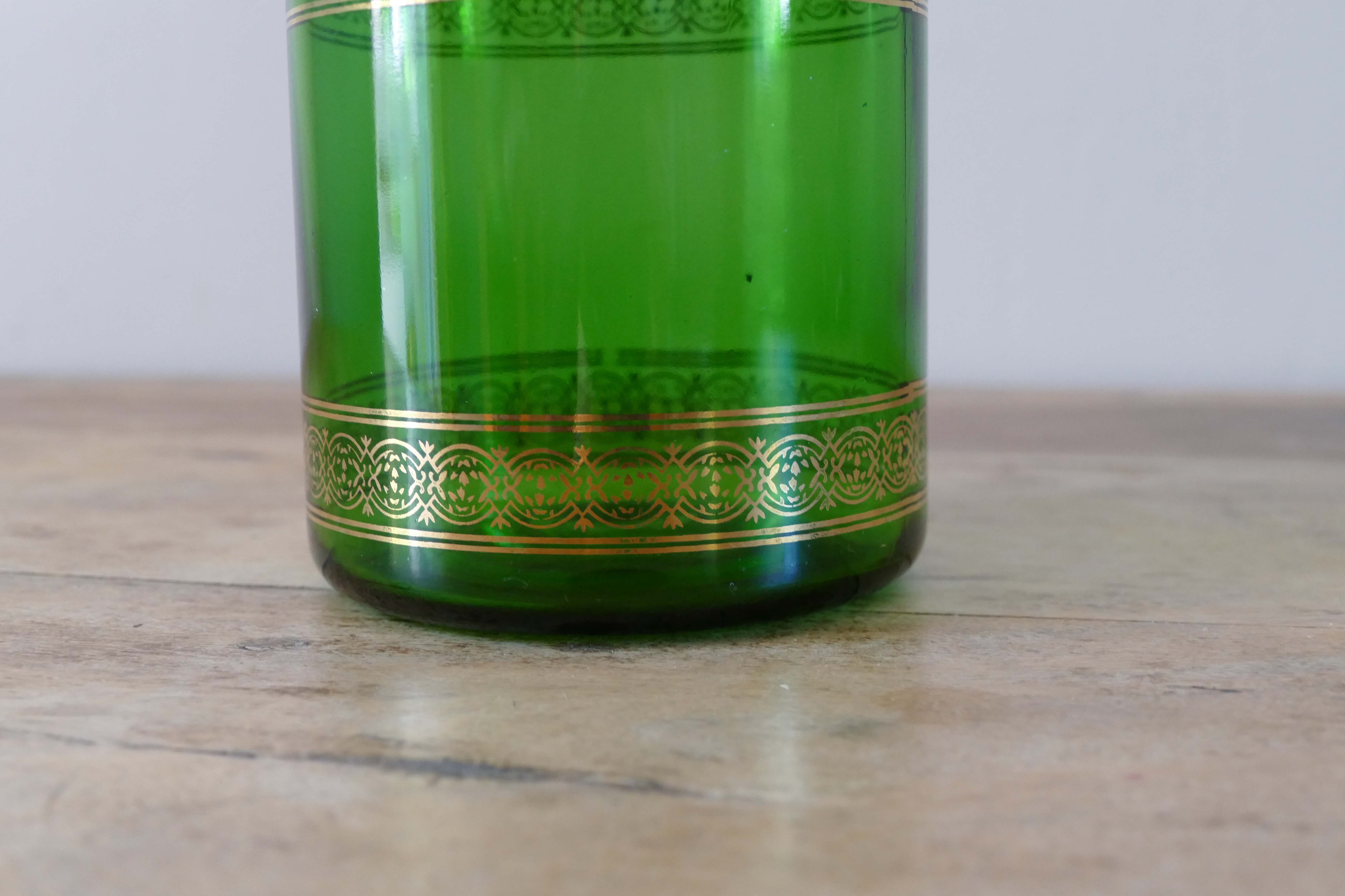 Green vintage apothecary pot and golden ledé