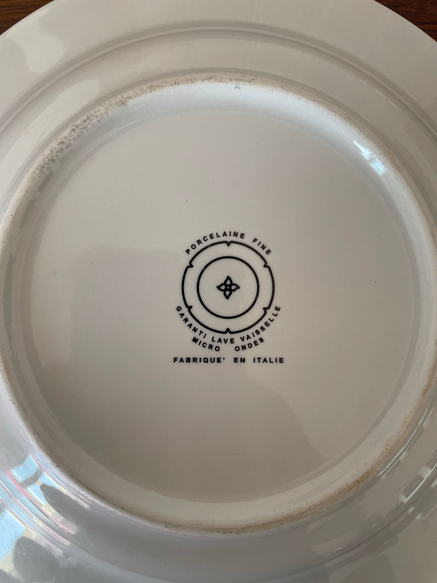Set of 5 deep porcelain plates from Italy.