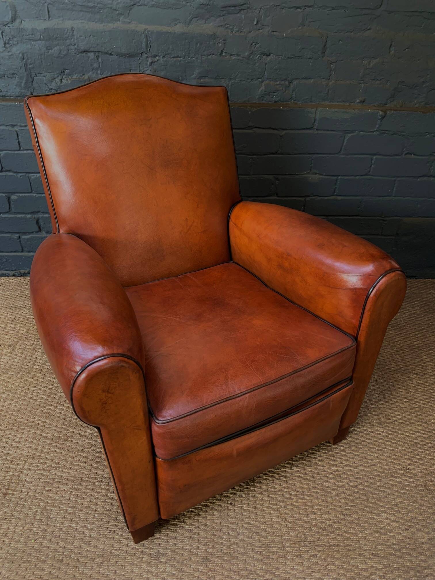 French leather club chair, chapeau de gendarme model circa 1930's in caramel