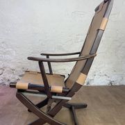 Colonial style leather armchair and ottoman