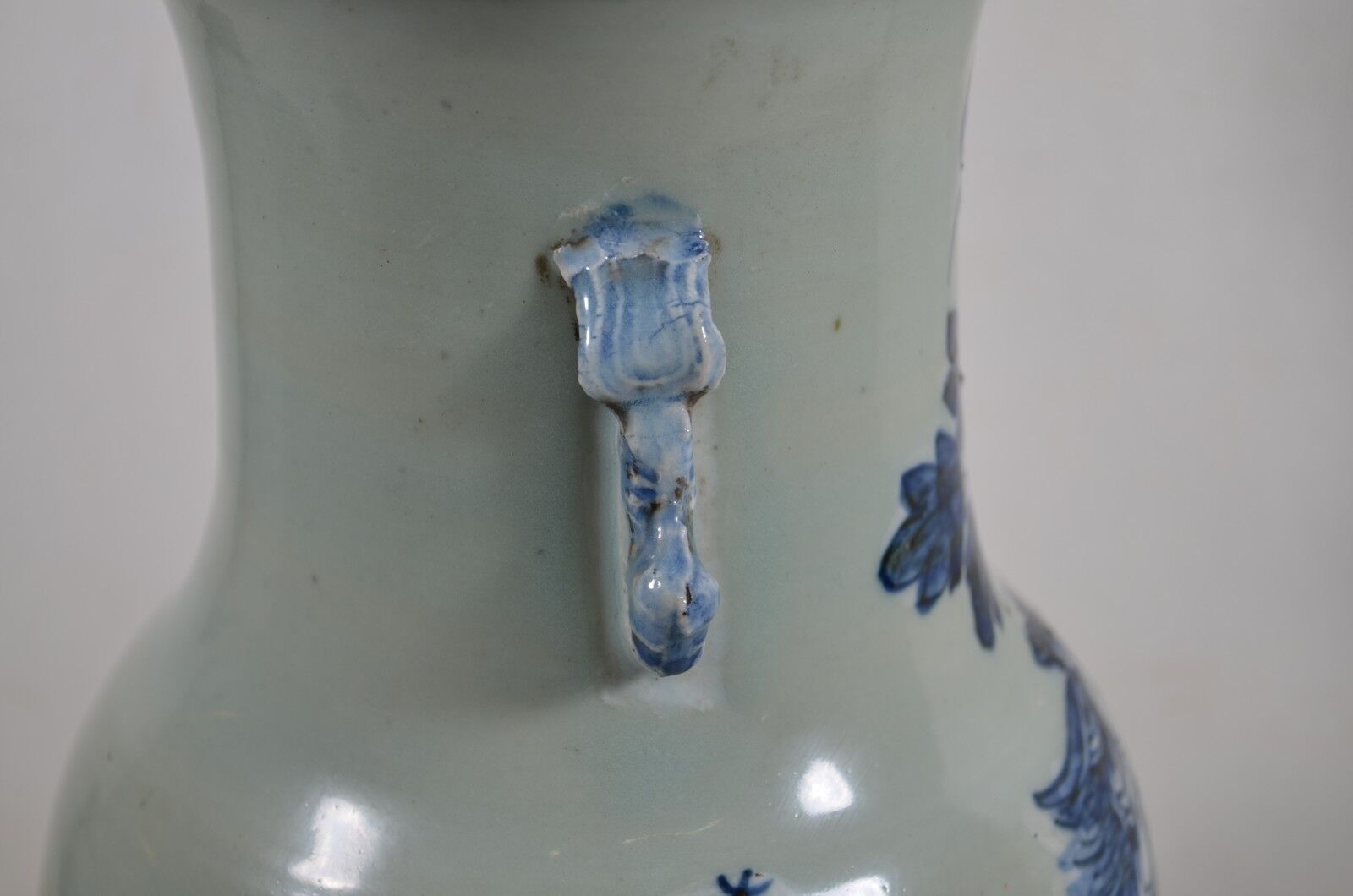 China. Porcelain mallet vase with blue and white phoenix decoration on a rock.
