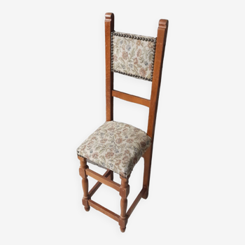 Old narrow seat chair in tapestry embroidery