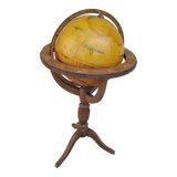 Old terrestrial globe world map on wooden stand