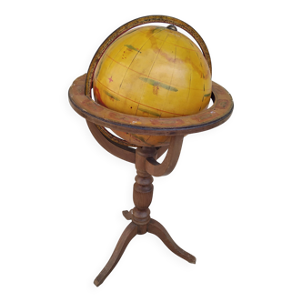 Old terrestrial globe world map on wooden stand