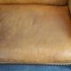 Unique old set of 2 club armchairs and a couch in cognac-colored leather with wheels