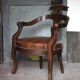 Barber chair in wood and leather with adjustable headrest, office chair.