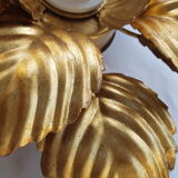 Golden metal flower sconce