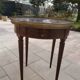 Gray marble mahogany pedestal table and brass gallery