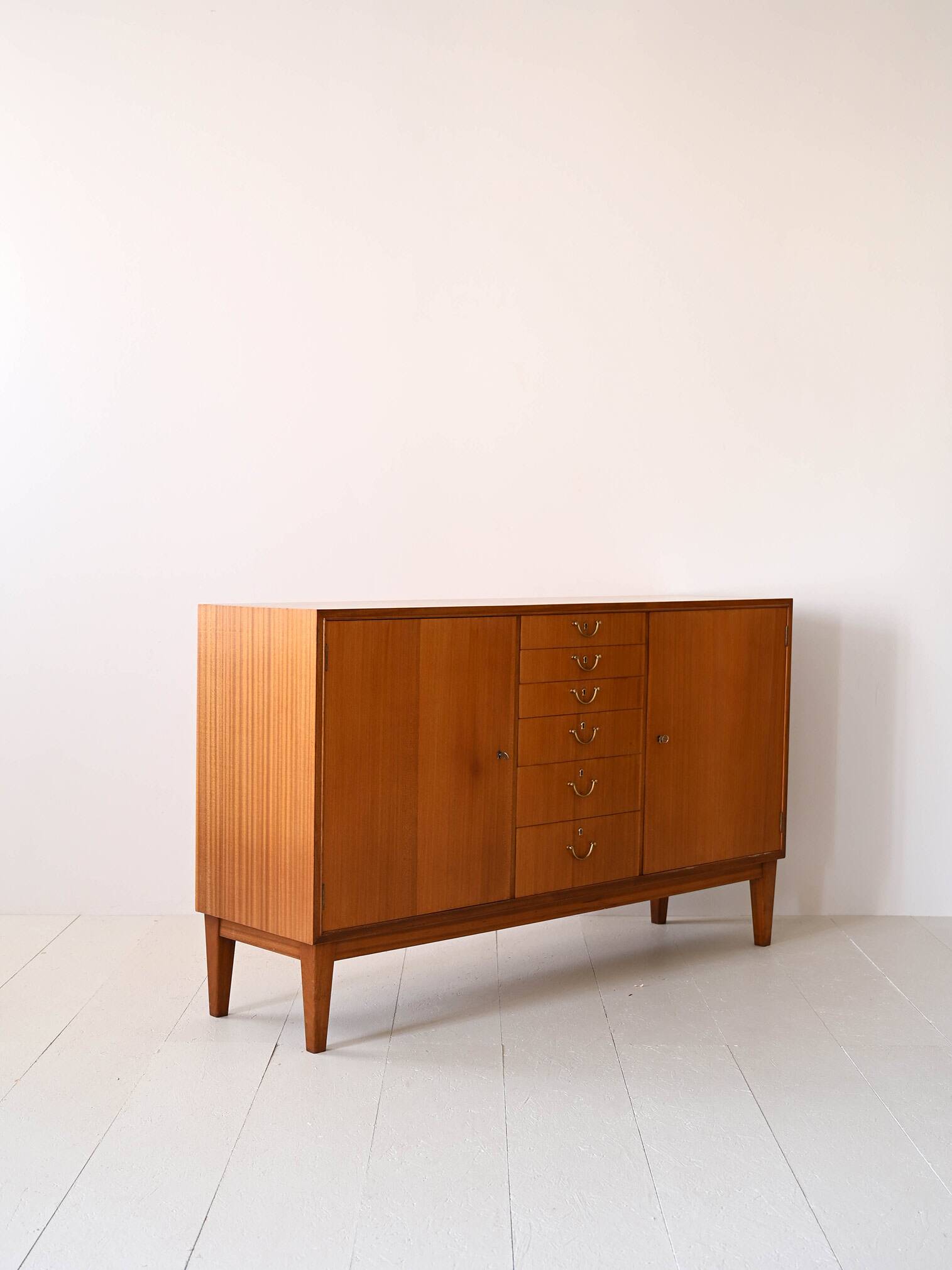 Scandinavian high sideboard with central drawers