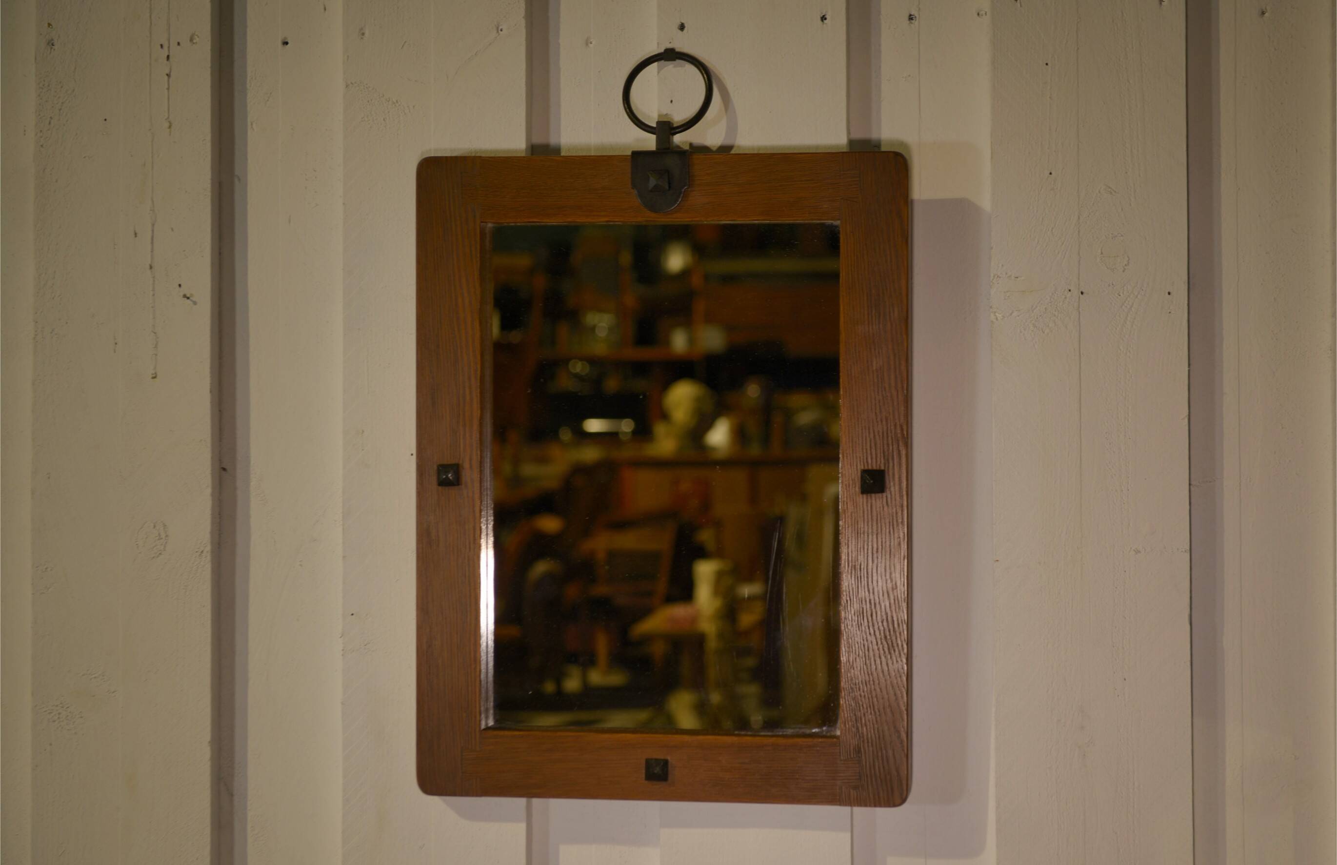 Brutalist mirror in solid oak with metal ring, 1960s.