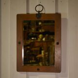 Brutalist mirror in solid oak with metal ring, 1960s.