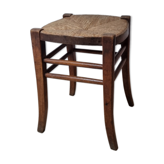 Antique stool made of straw and wood
