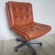 Vintage armchair in brown leather