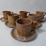 6 stoneware cups and saucers