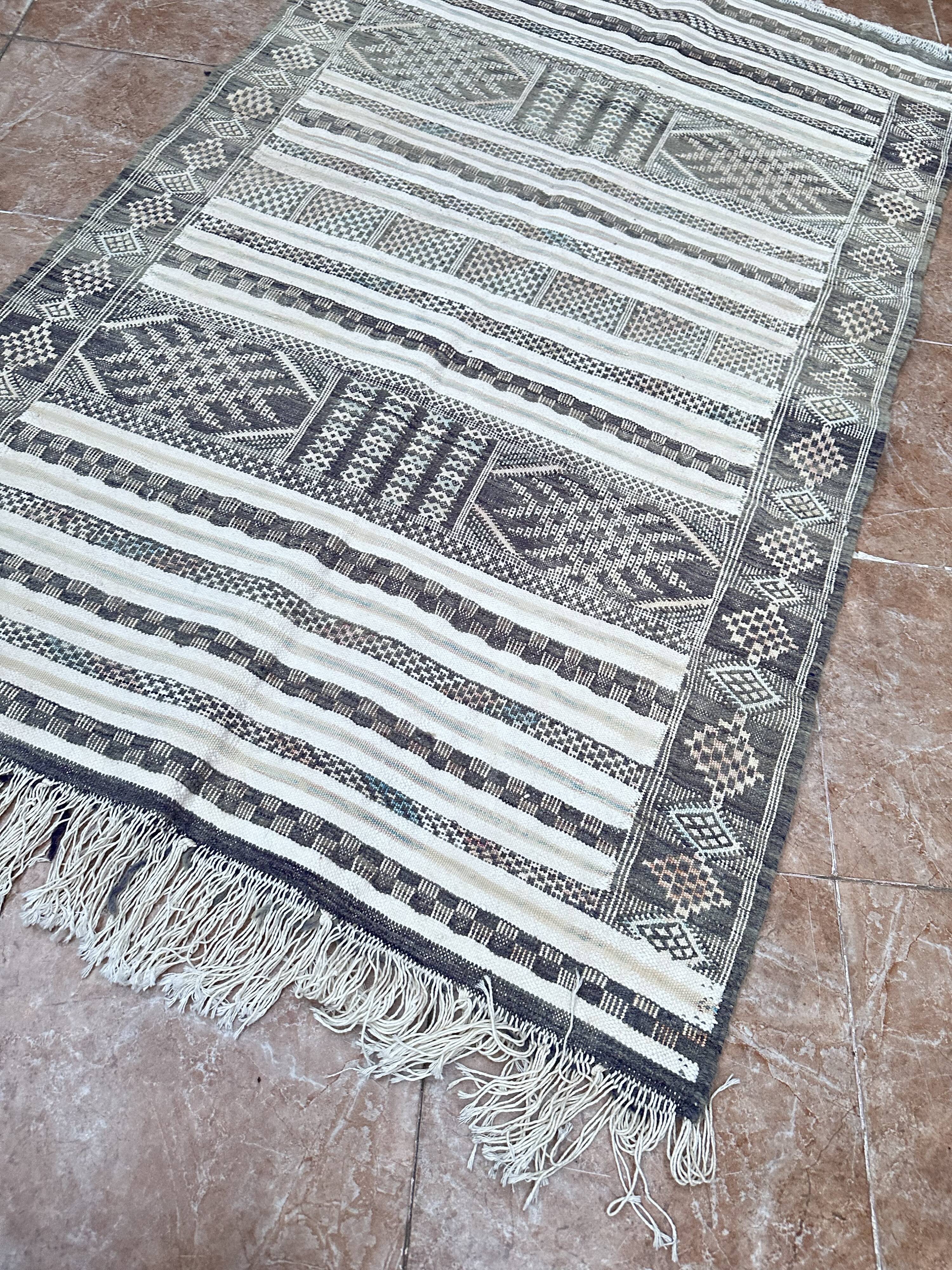 Handwoven Kilim rug made of camel wool, silk, and cactus.