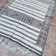 Handwoven Kilim rug made of camel wool, silk, and cactus.