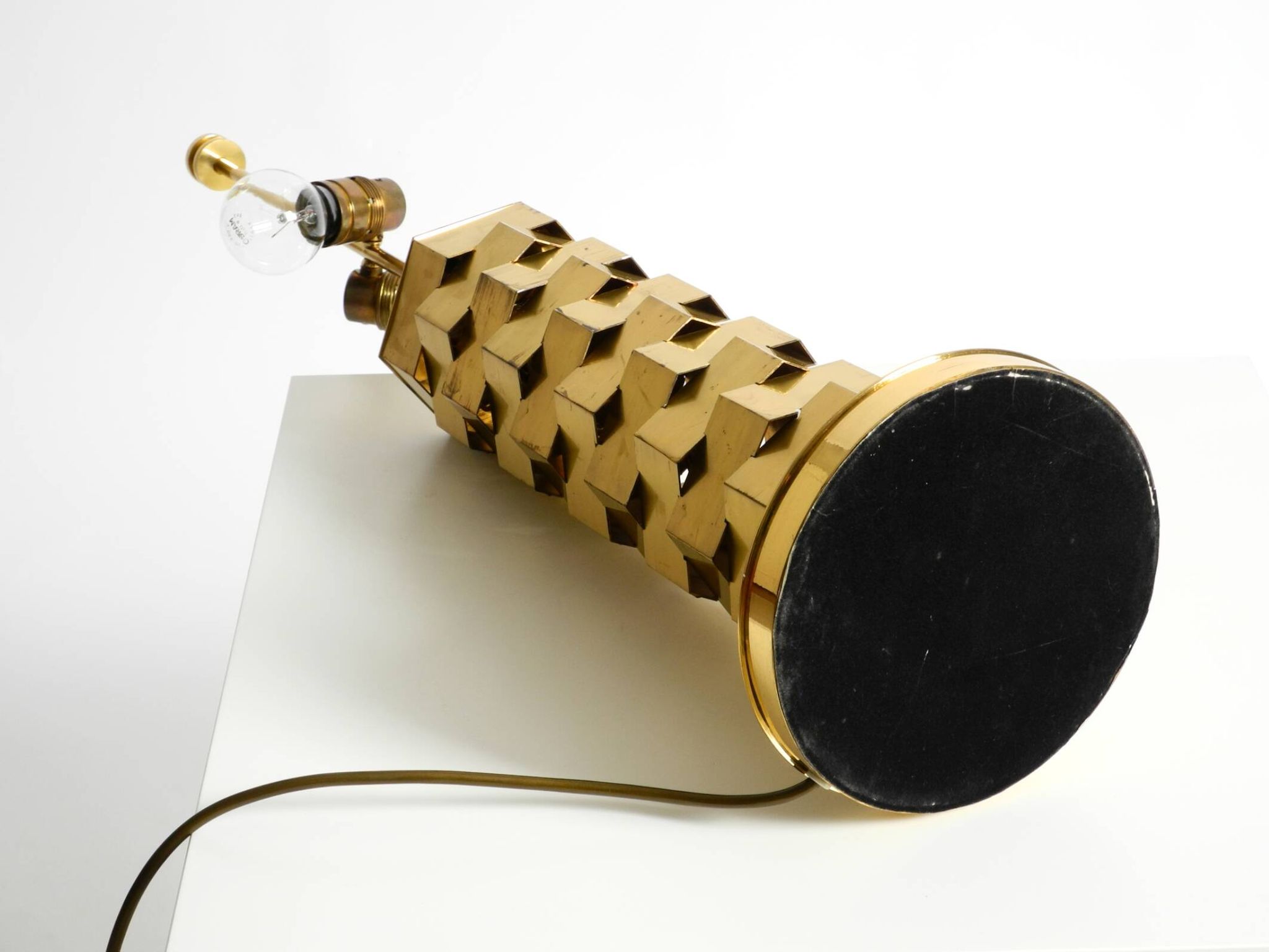 1960s brass table lamp by Vereinigte Werkstätten with an illuminated base