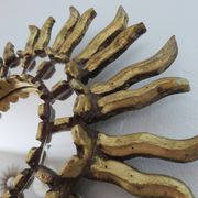 Golden wooden sun mirror with inlays from the early 20th century.
