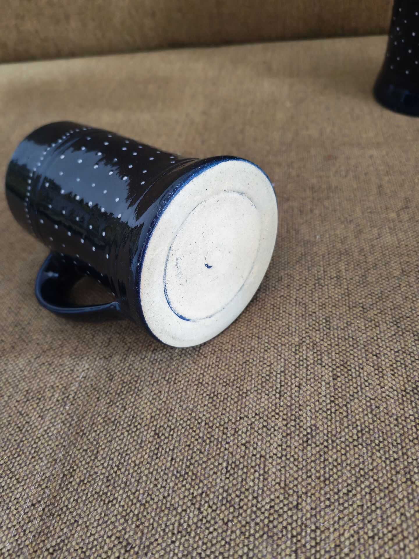 Two vintage mugs in traditional German earthenware.