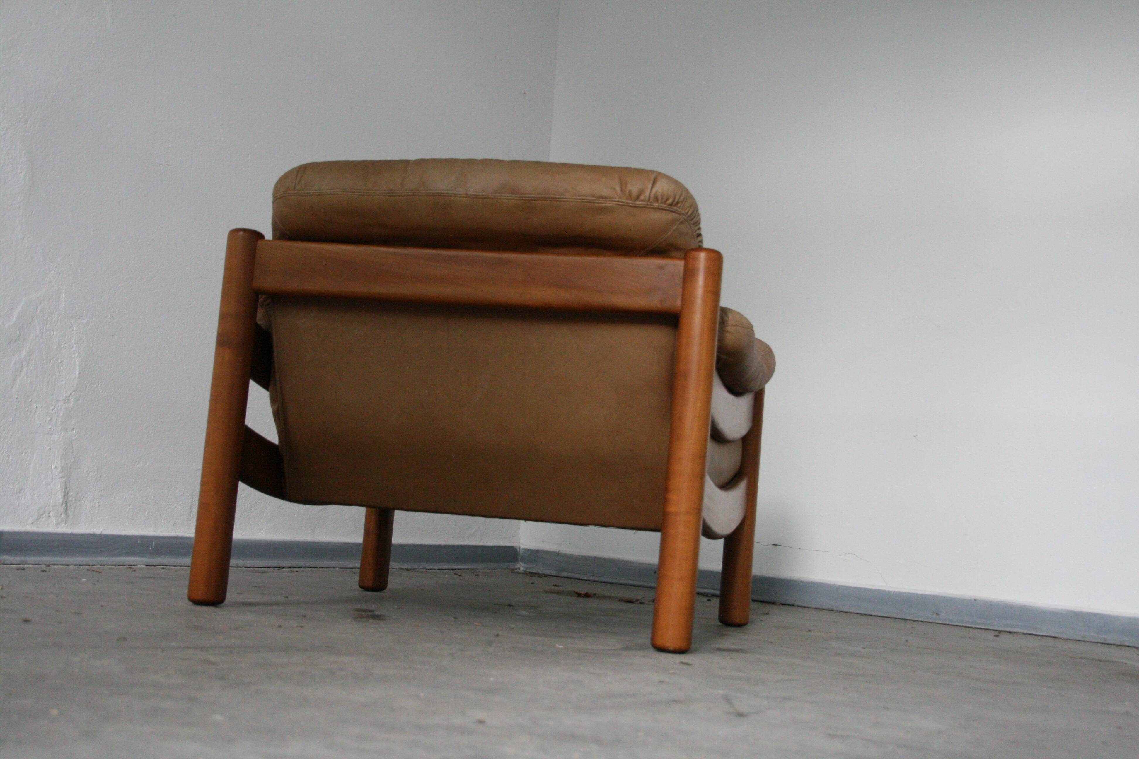 Teak and leather club armchairs