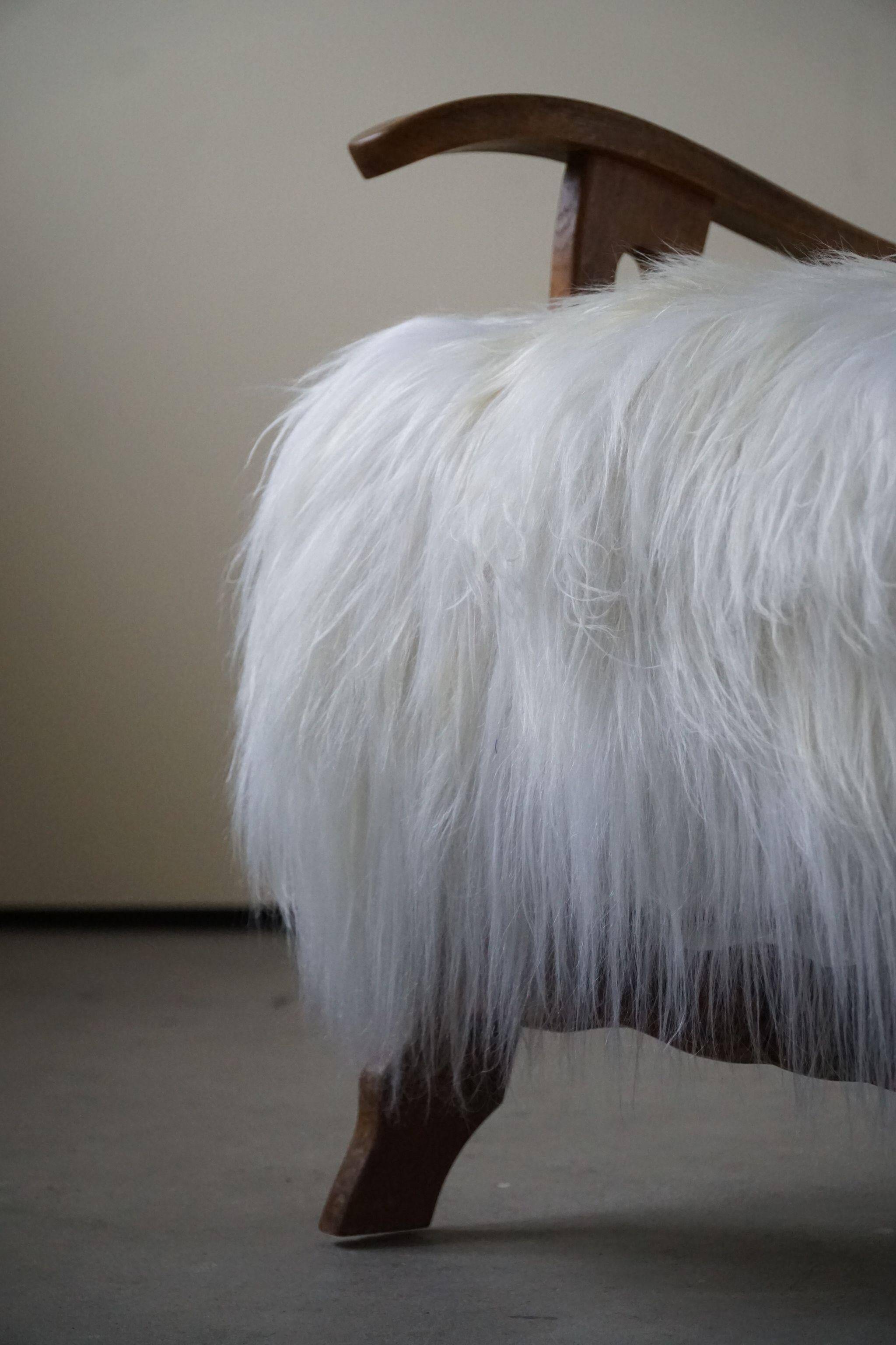 Henning Kjærnulf, armchair reupholstered in long-haired Icelandic sheepskin, 1950
