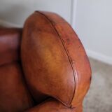 Fauteuil club en cuir patiné