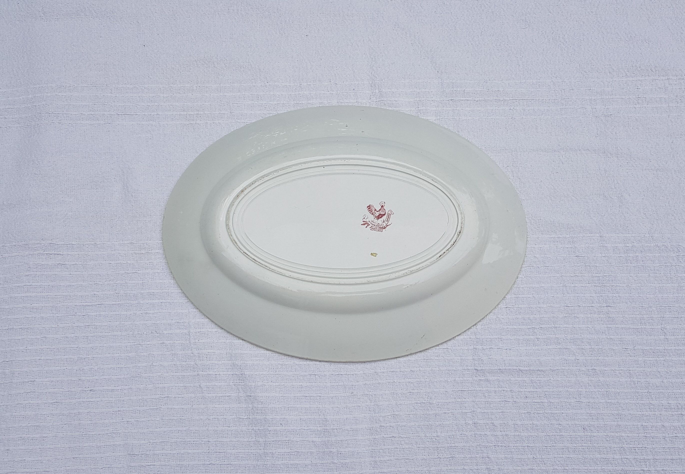 Oval serving dish in earthenware of Sté Amandinoise model Margot, iron earth.