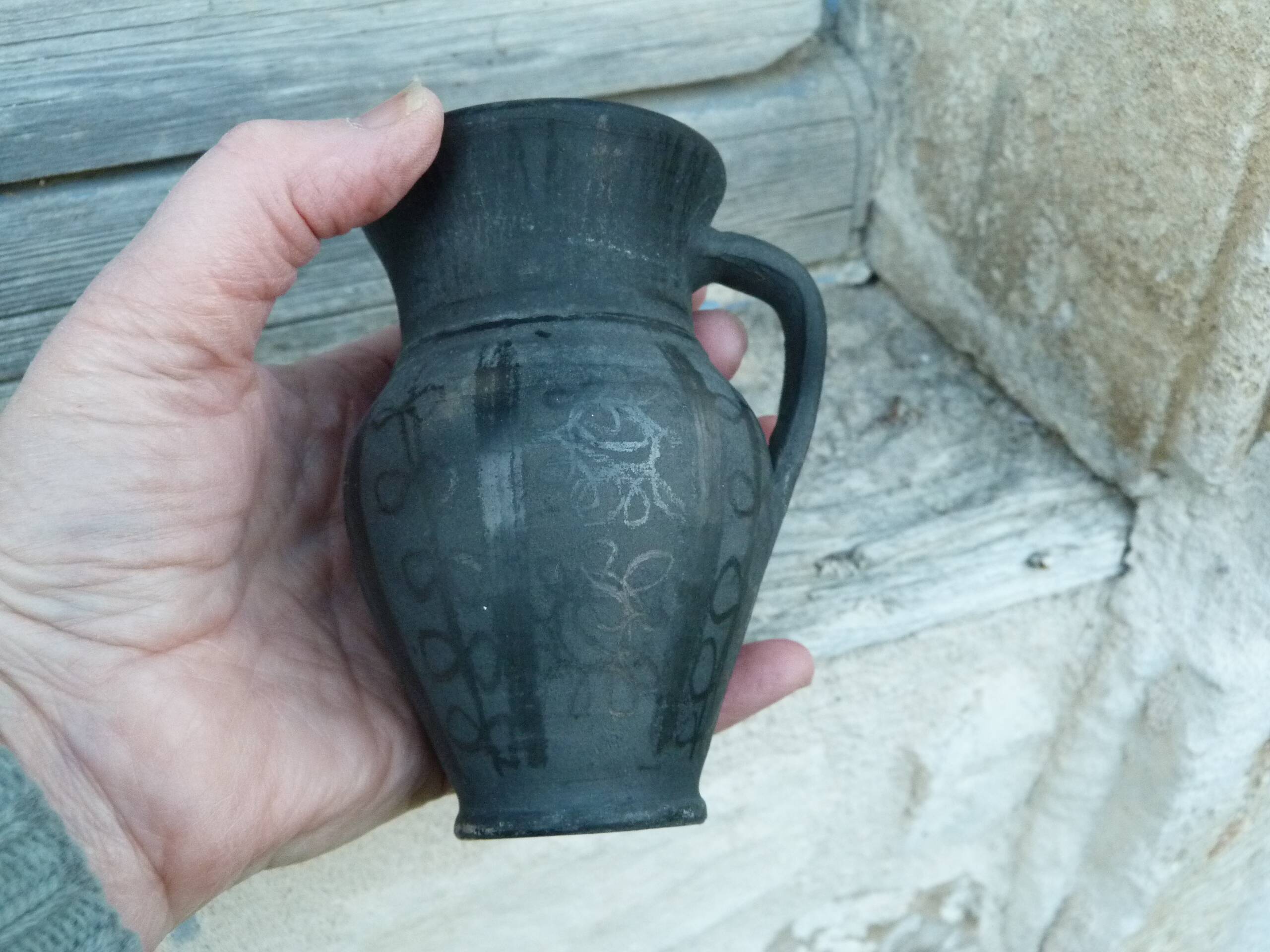 Pitcher in matte and glossy black pottery
