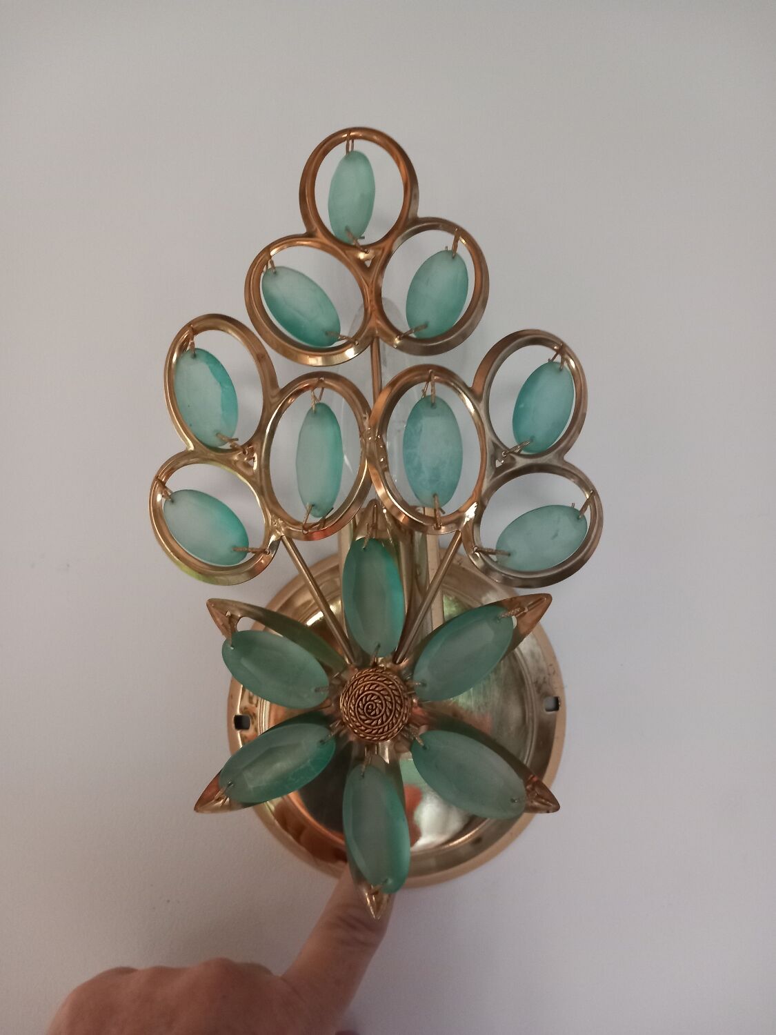 Gold metal wall light with light blue tassels