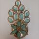 Gold metal wall light with light blue tassels