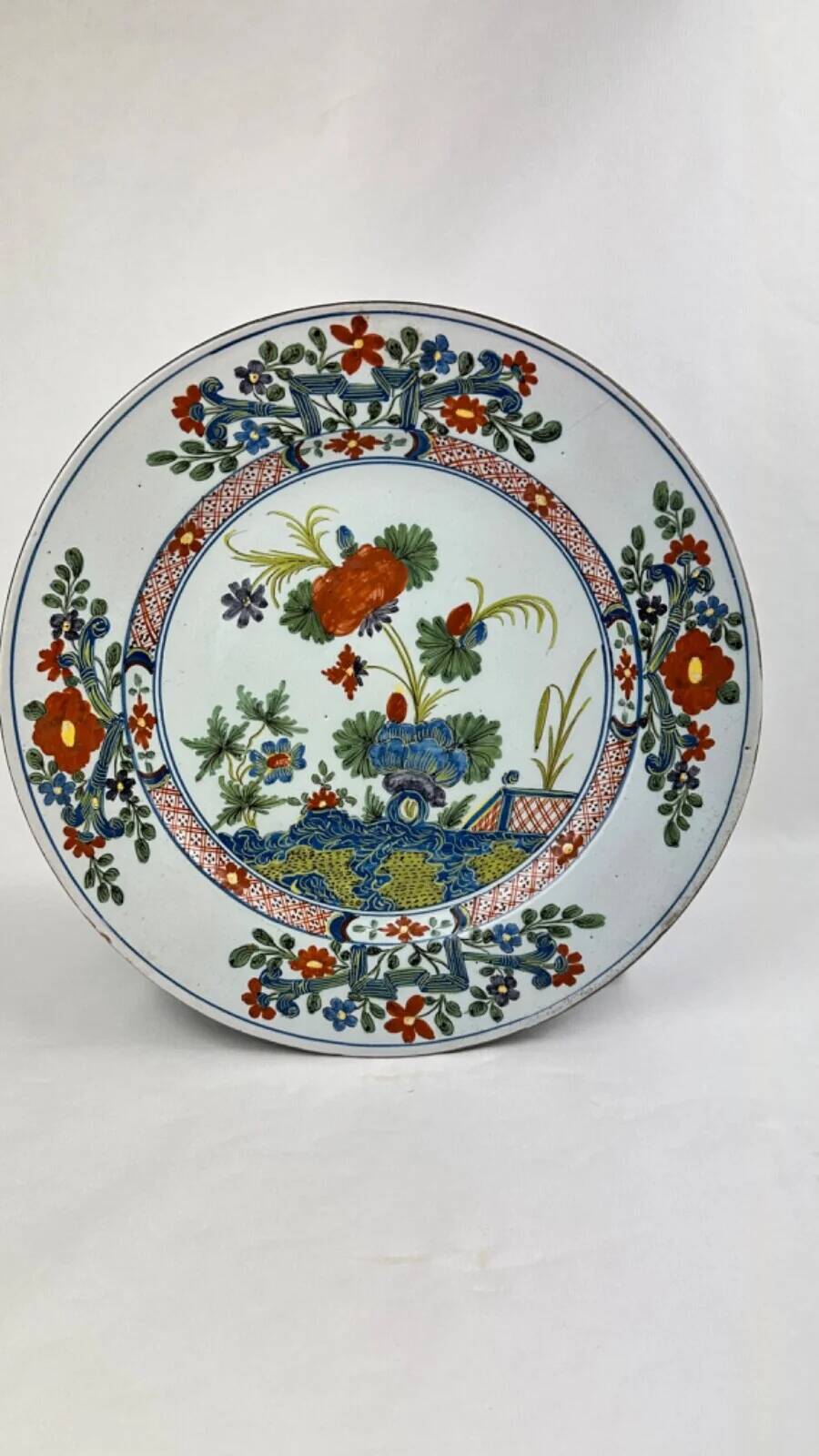 Delftware plate with gilded highlights, relief decoration, 18th century, 35 cm