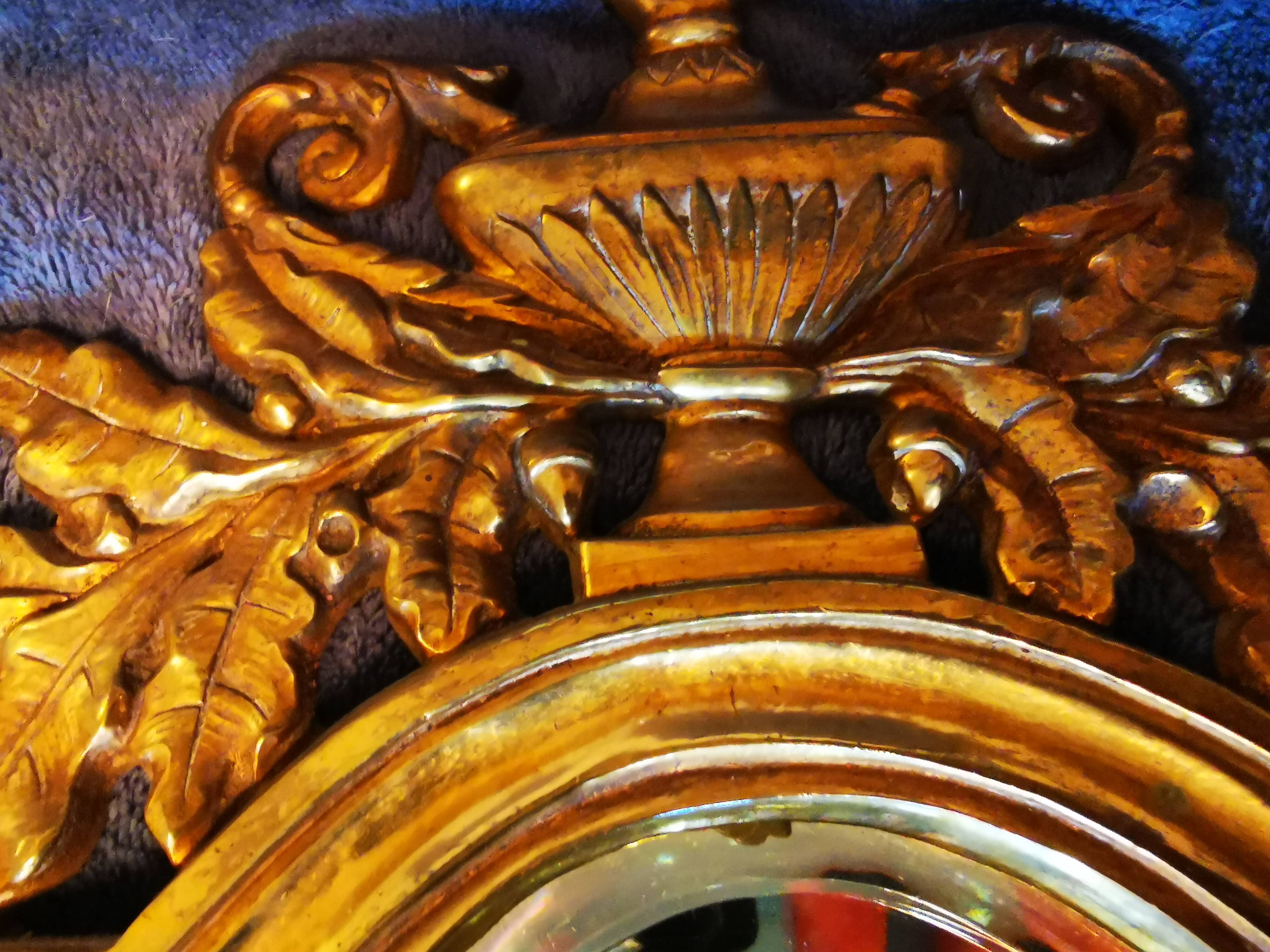 Pair of chissed and gilded bronze mirrors forming appliques