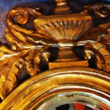 Paire de miroirs en bronze ciselé et doré formant appliques