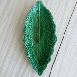 Green earthenware dish in the shape of a leaf