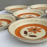 Set 11 plates 1970 Revernay Sarreguemines orange and brown on sandstone background