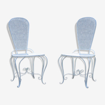 Two small wrought iron chairs
