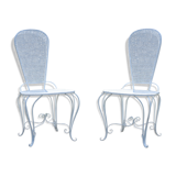 Two small wrought iron chairs