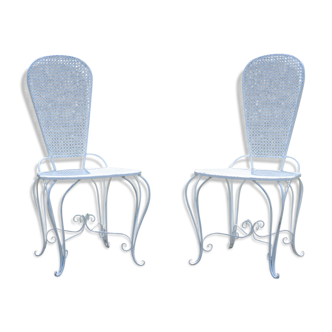 Two small wrought iron chairs