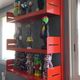 Modular red metal wall shelf in Congresso Lips Vago style.