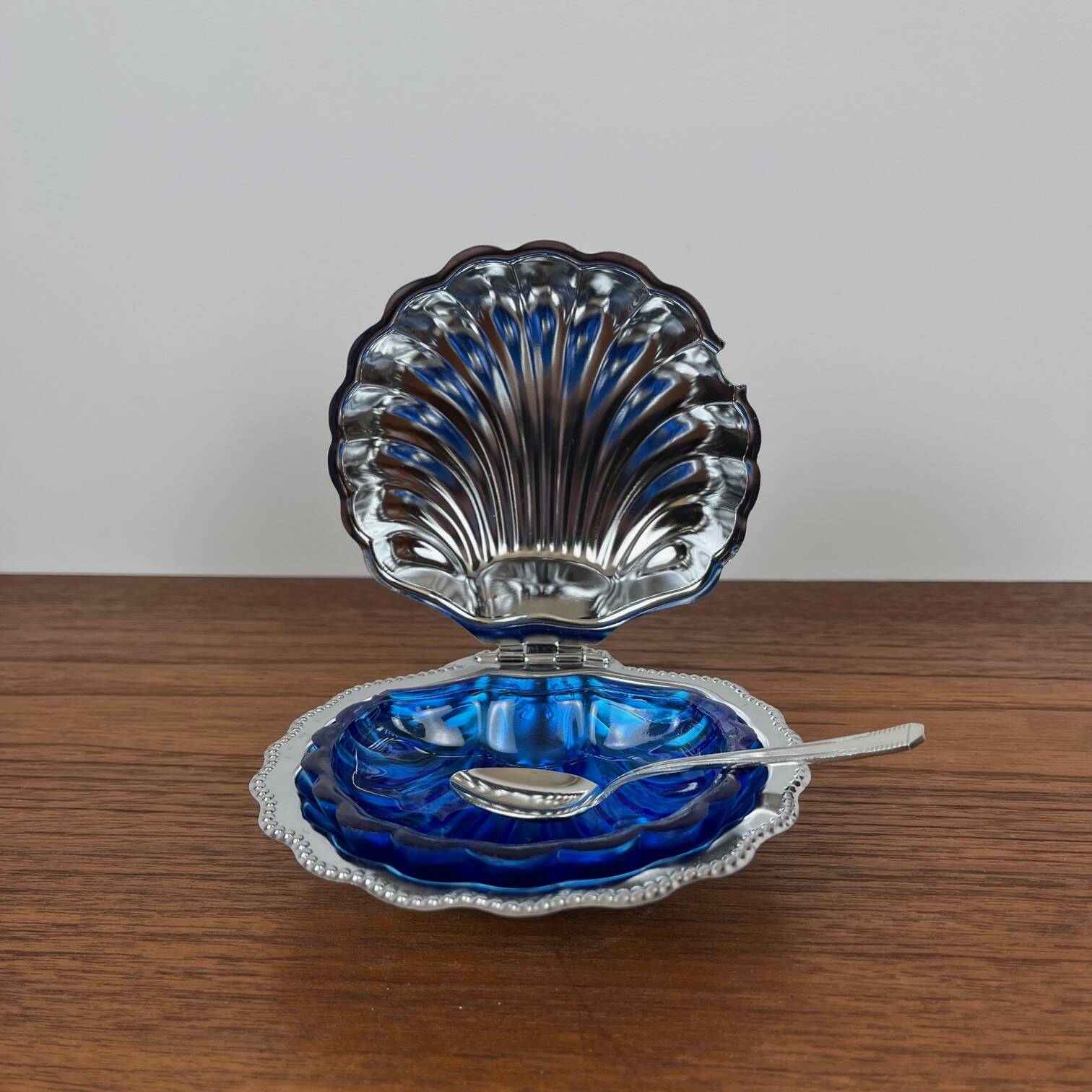 Silver-plated metal shell butter dish with blue insert, 1970